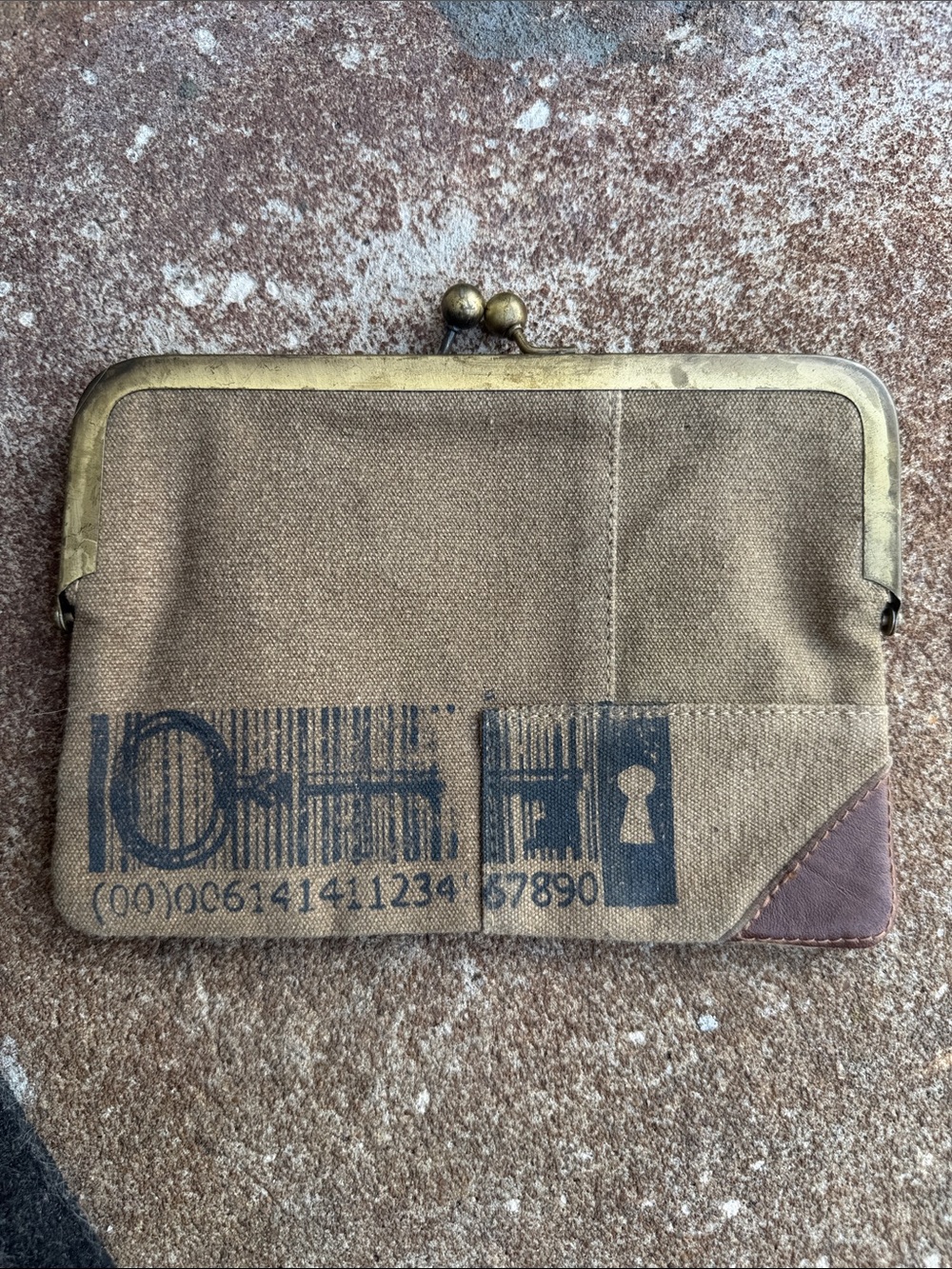 Mona B. Canvas Kiss-Lock Clutch Wallet in Brown with Brass Frame.